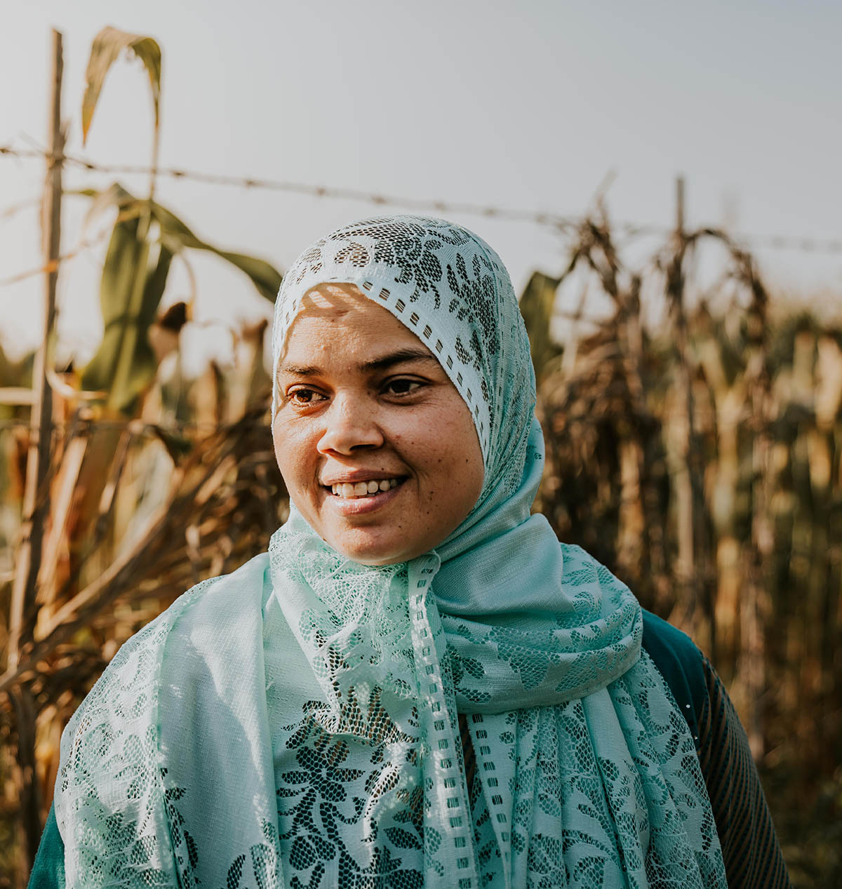 Woman smiling in a corn field