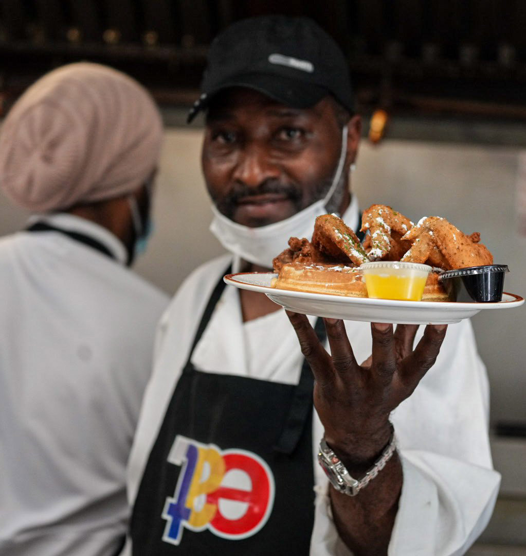 Chef proudly displays a dish