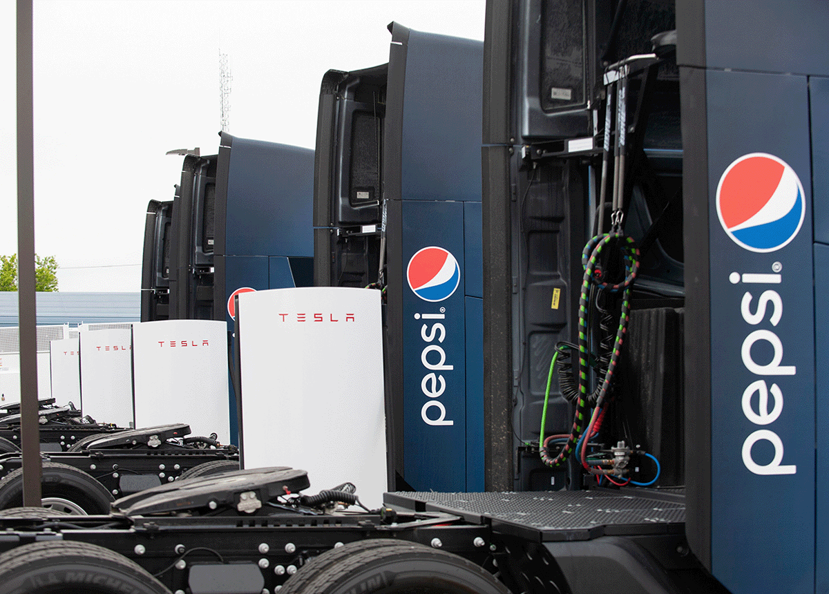 Pepsi trucks plugged into Tesla charging stations