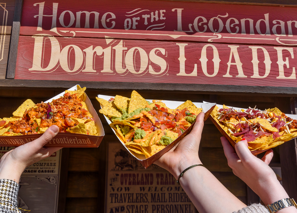 Friends holding up Doritos Loaded in front of