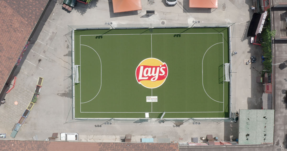 A substantiable football pitched made from repurposed Lay’s chip bags, which benefits both the community and climate.