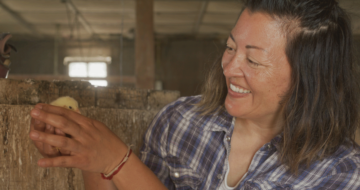 Wendy Johnson holding a baby chicken