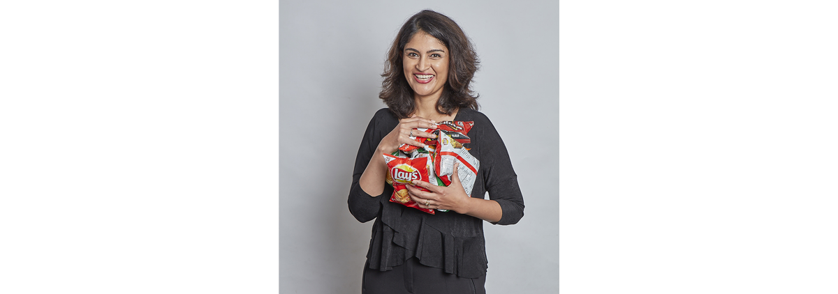 Avantika with some of her favorite PepsiCo snacks.