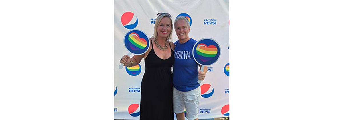 Tara with her partner, Lee-Ann, at a PepsiCo Pride event.