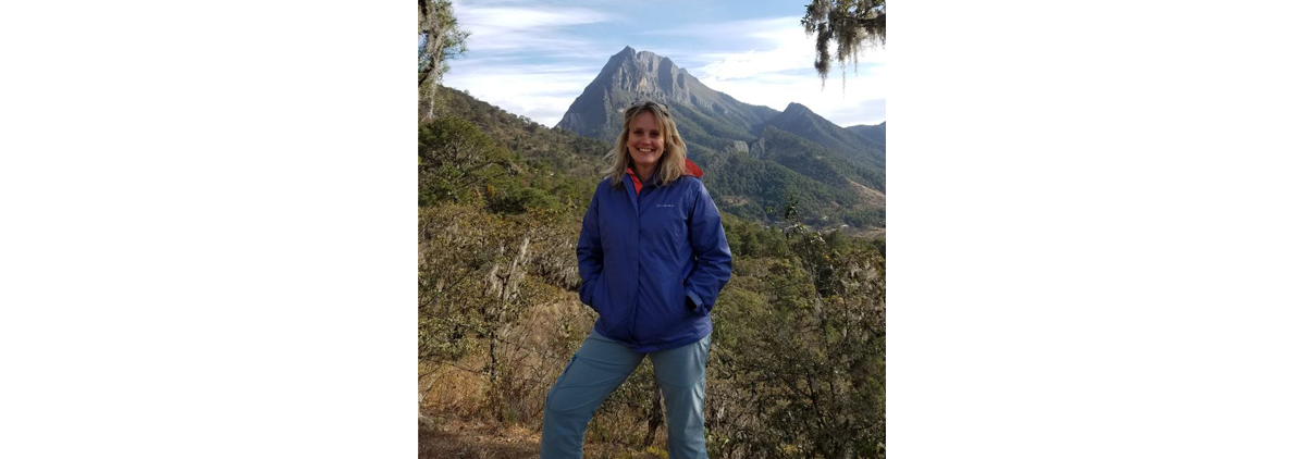 Roberta standing in front of a mountain in Mexico