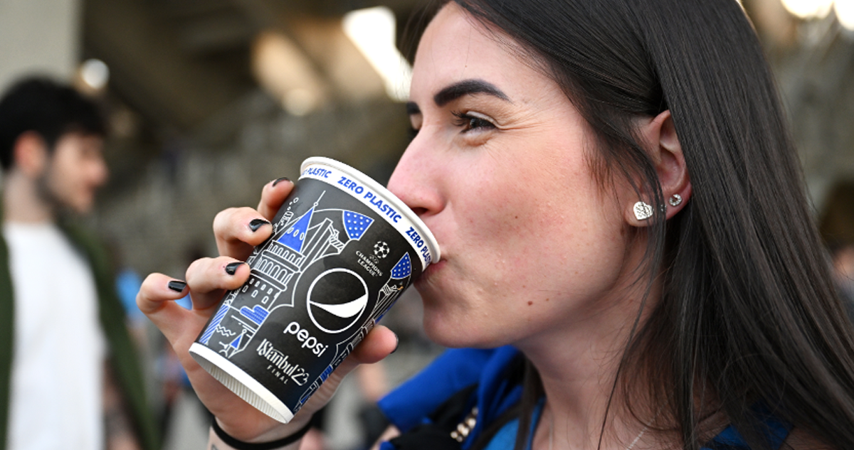 Woman drinking from a fully recyclable, zero plastic and biodegradable fiber cup