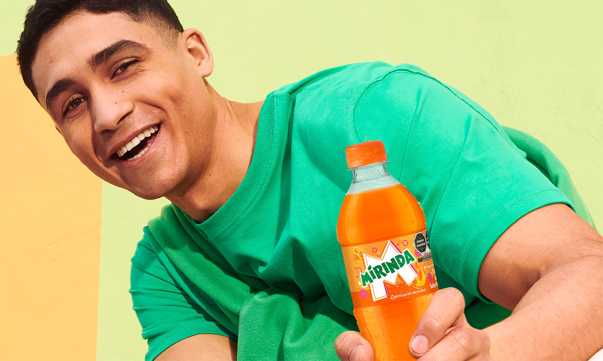 Man holds Mirinda bottle