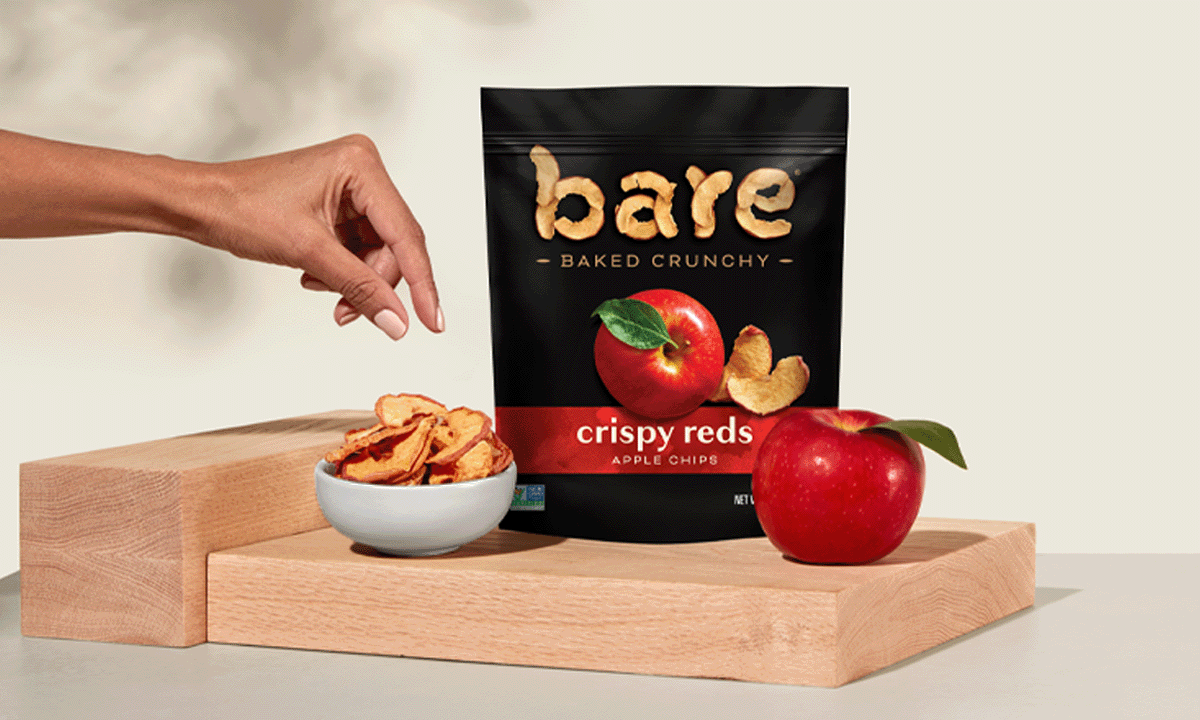 Hand reaching for Bare apples in a bowl