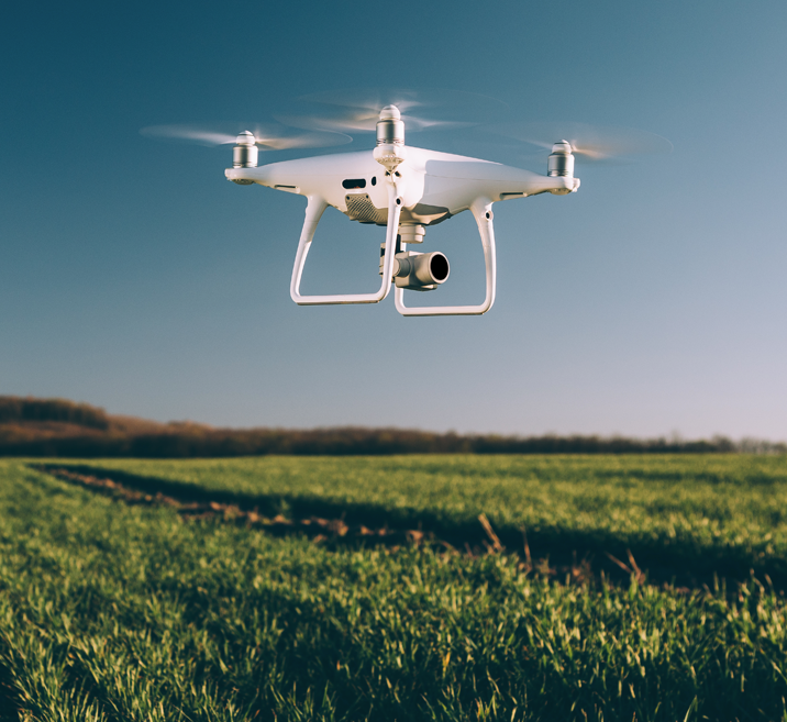 Drone flying over a field