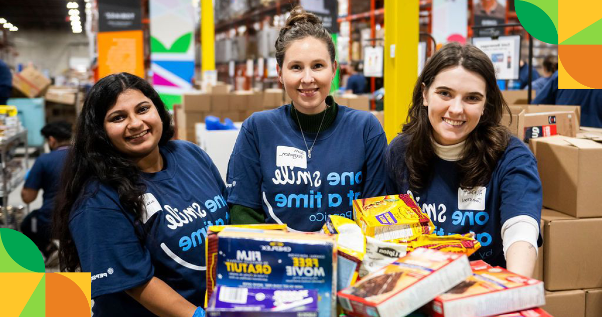 Three female PepsiCo employees volunteering at a food bank