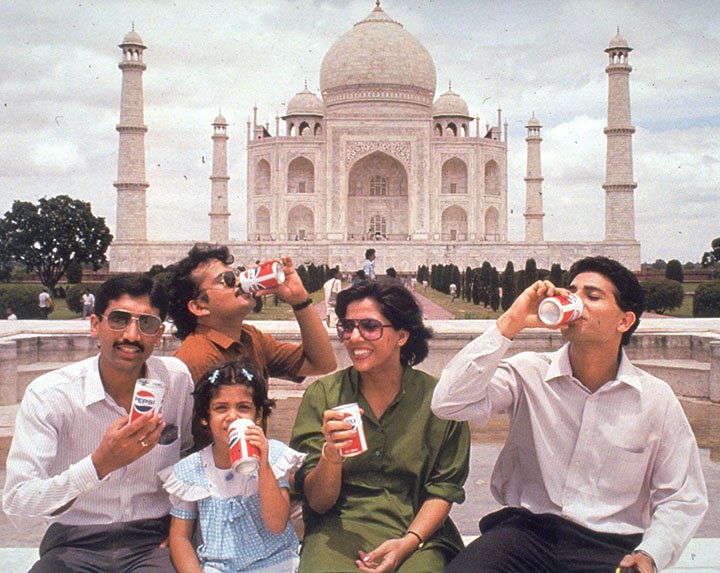 Indian consumers drinking Pepsi in front of the Taj Mahal, taken 1989